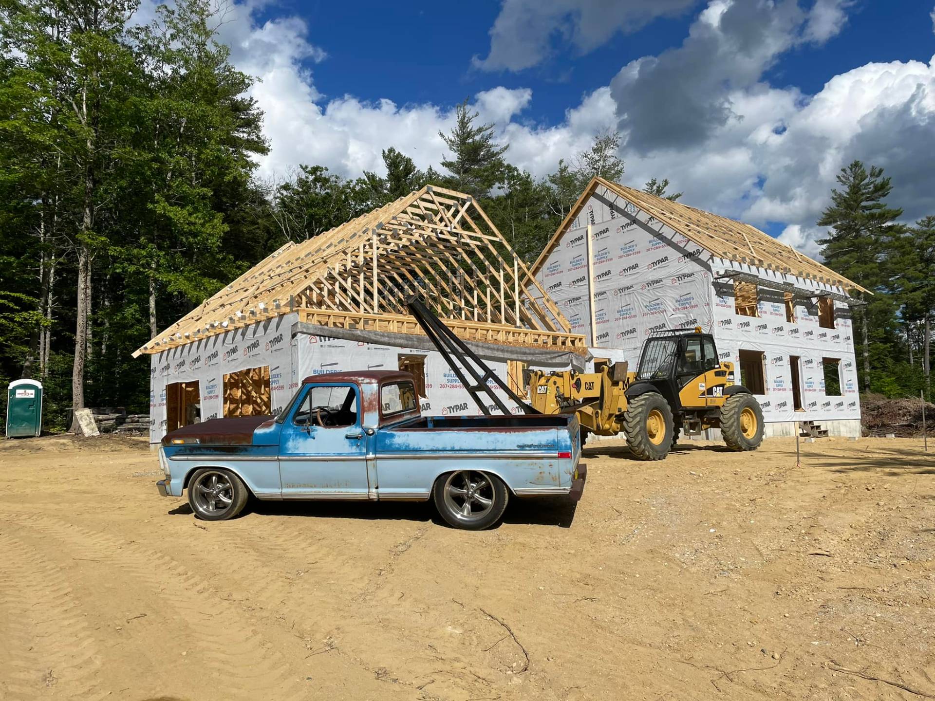 J.M. Builders branded equipment on a Maine jobsite