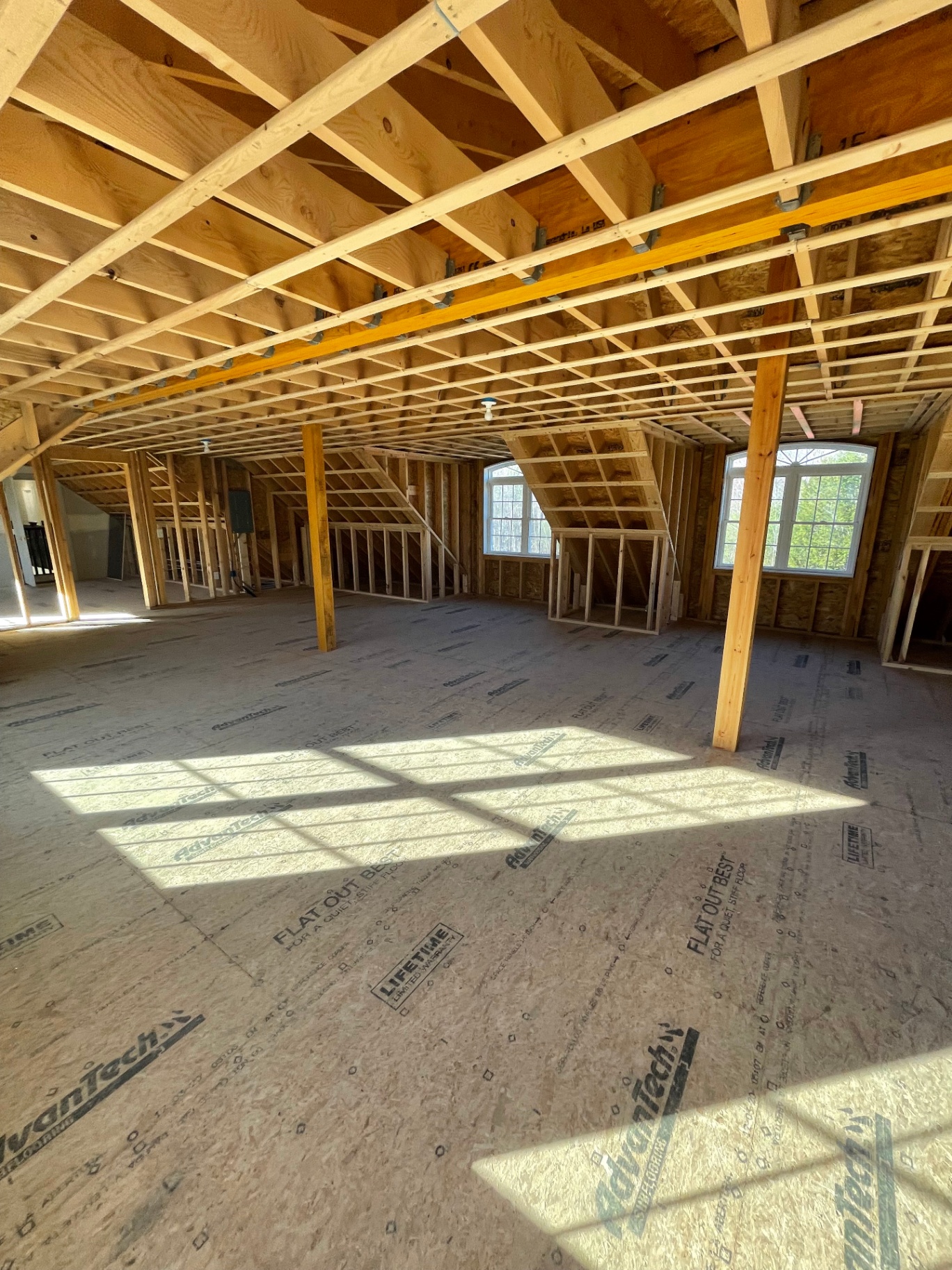 Open framed second floor with arched windows
