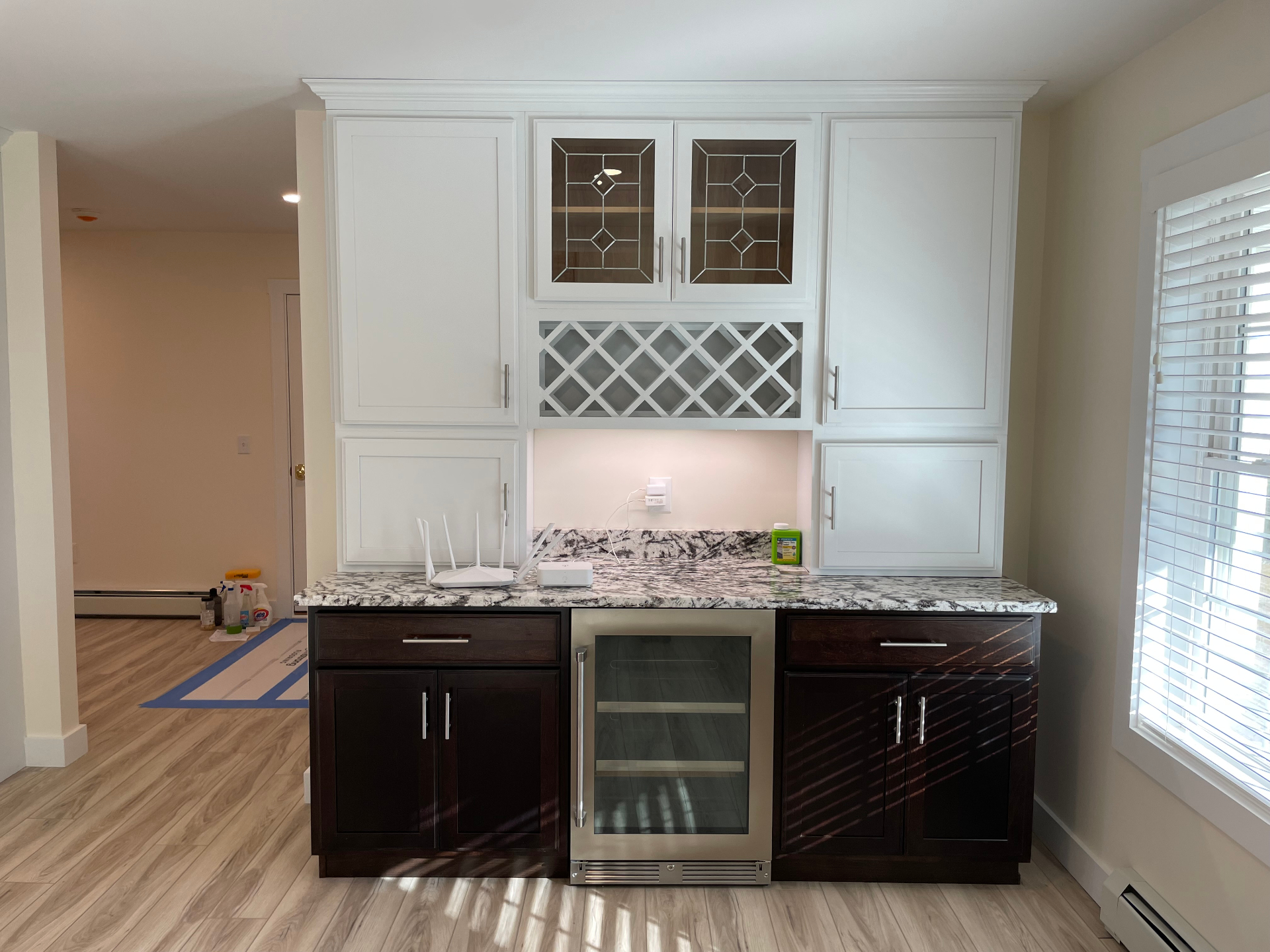 Custom wet bar with leaded-glass cabinets and granite